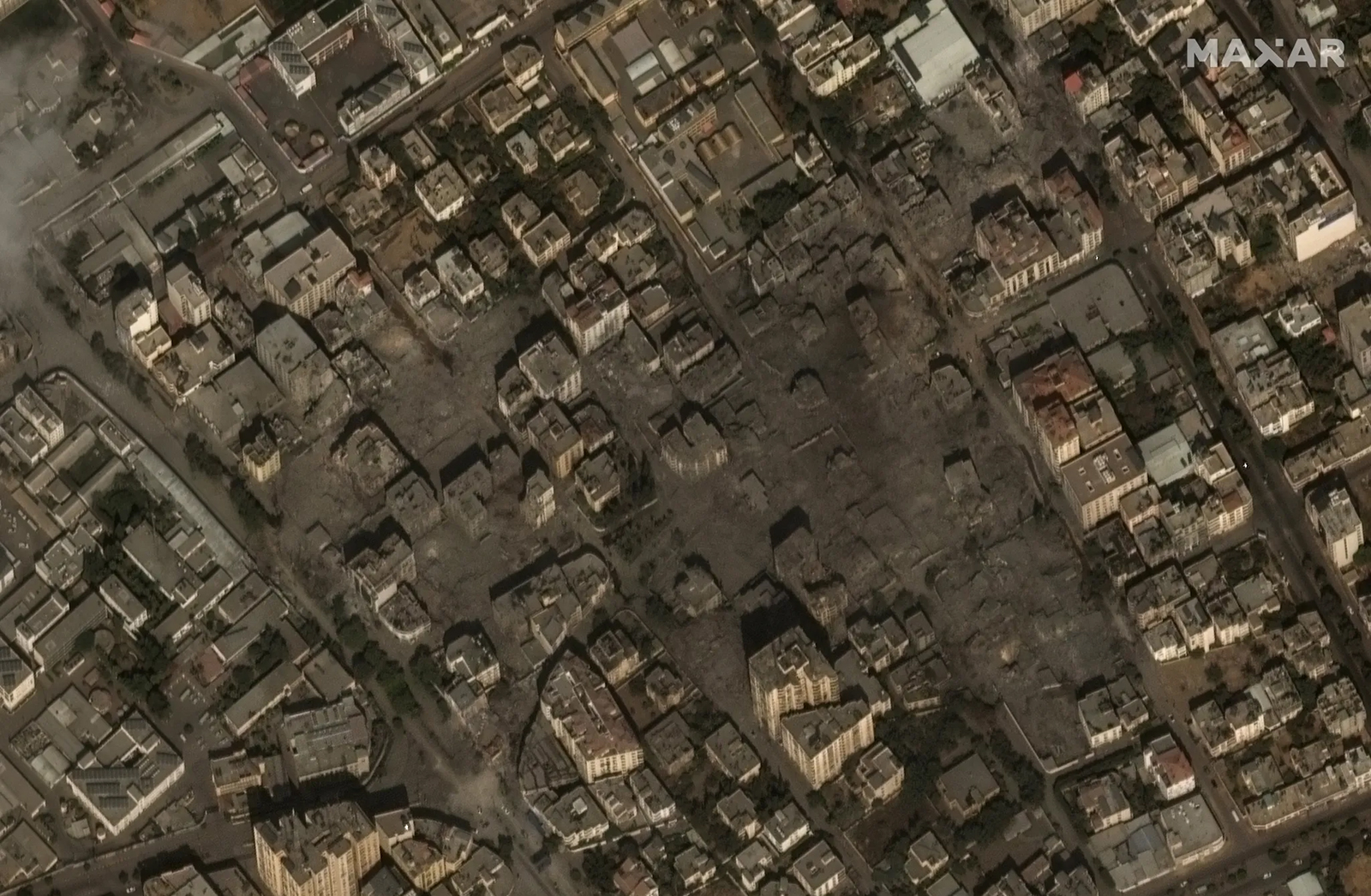 A satellite view of the Gaza Strip following days of Israeli airstrikes. Destroyed buildings can be viewed covered in dust and explosive remains.