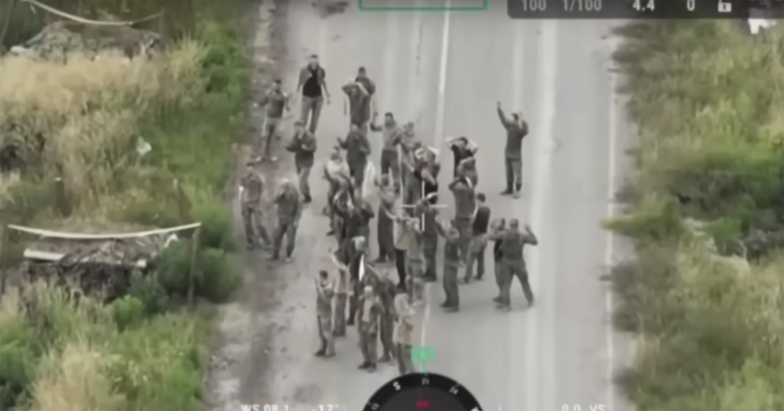 Russian troops photographed waving a white flag in surrender in Kursk.