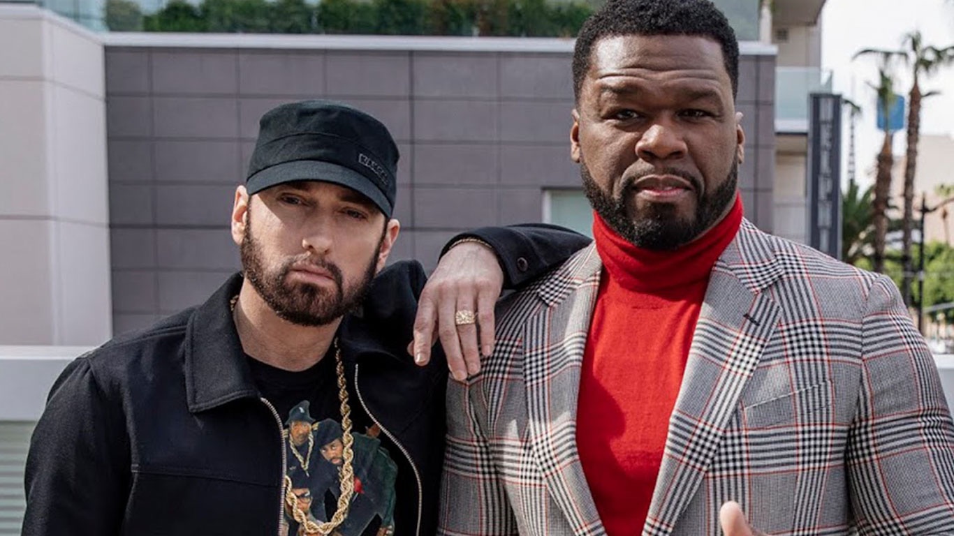 Eminem and 50 Cent at a media event, hinting at their highly anticipated joint album.
