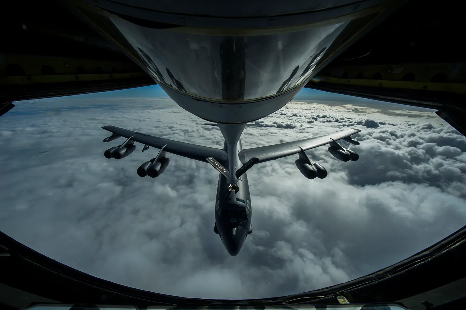 B-52 Stratofortress bomber being refuelled in-flight during a US Air Force mission over the Pacific Ocean.
