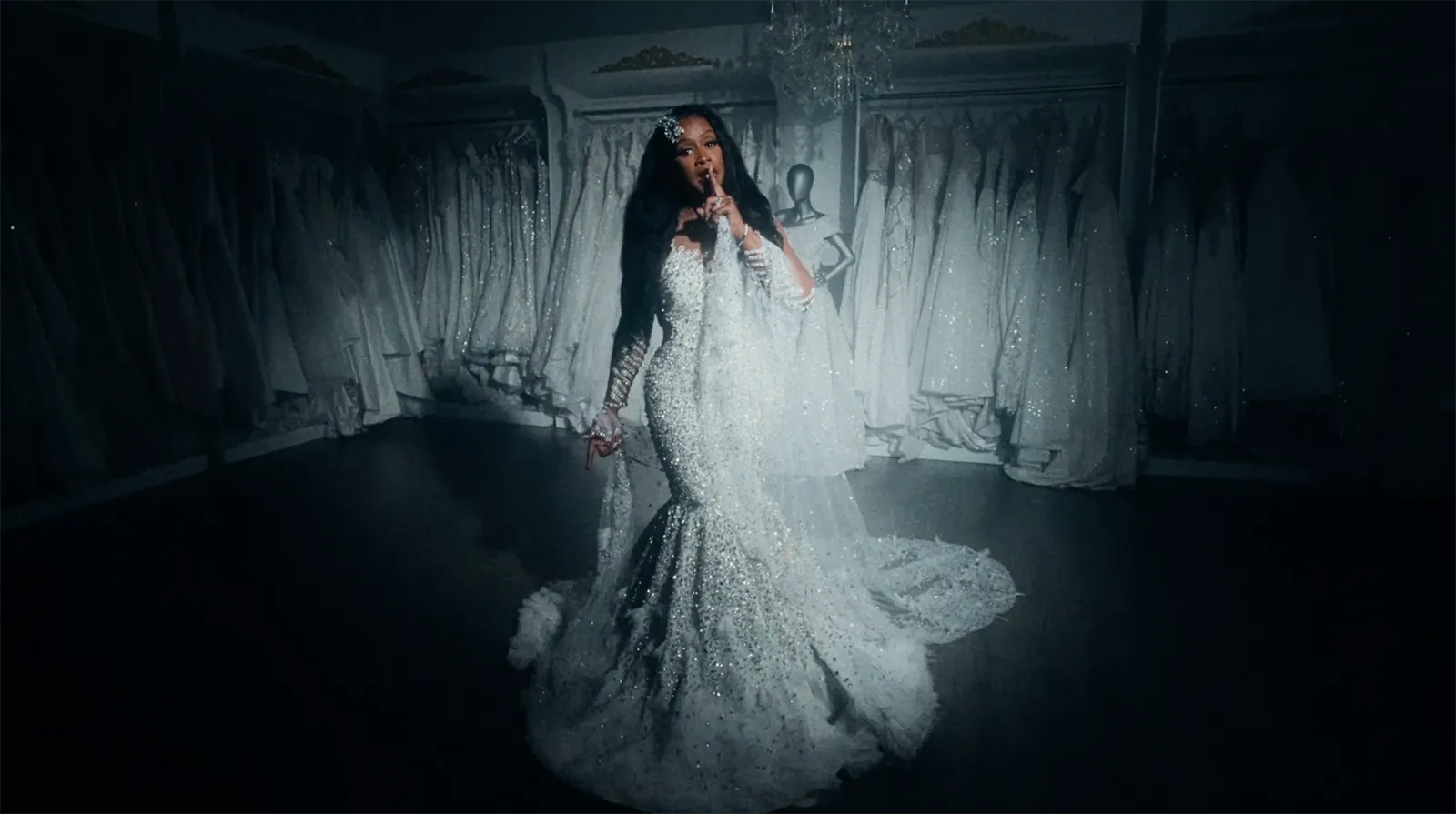 Remy Ma wearing a white wedding dress in the “Why I Get Married?” music video for her Alimony EP.