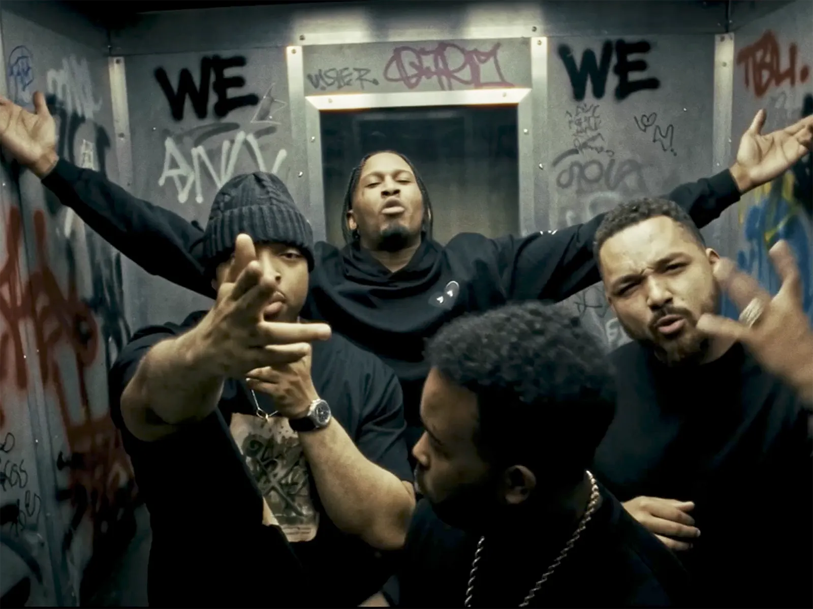 Scorcher, Milli Major, Chaos, Yellows and Blair perform together in a graffiti-covered room for their track “WE”.