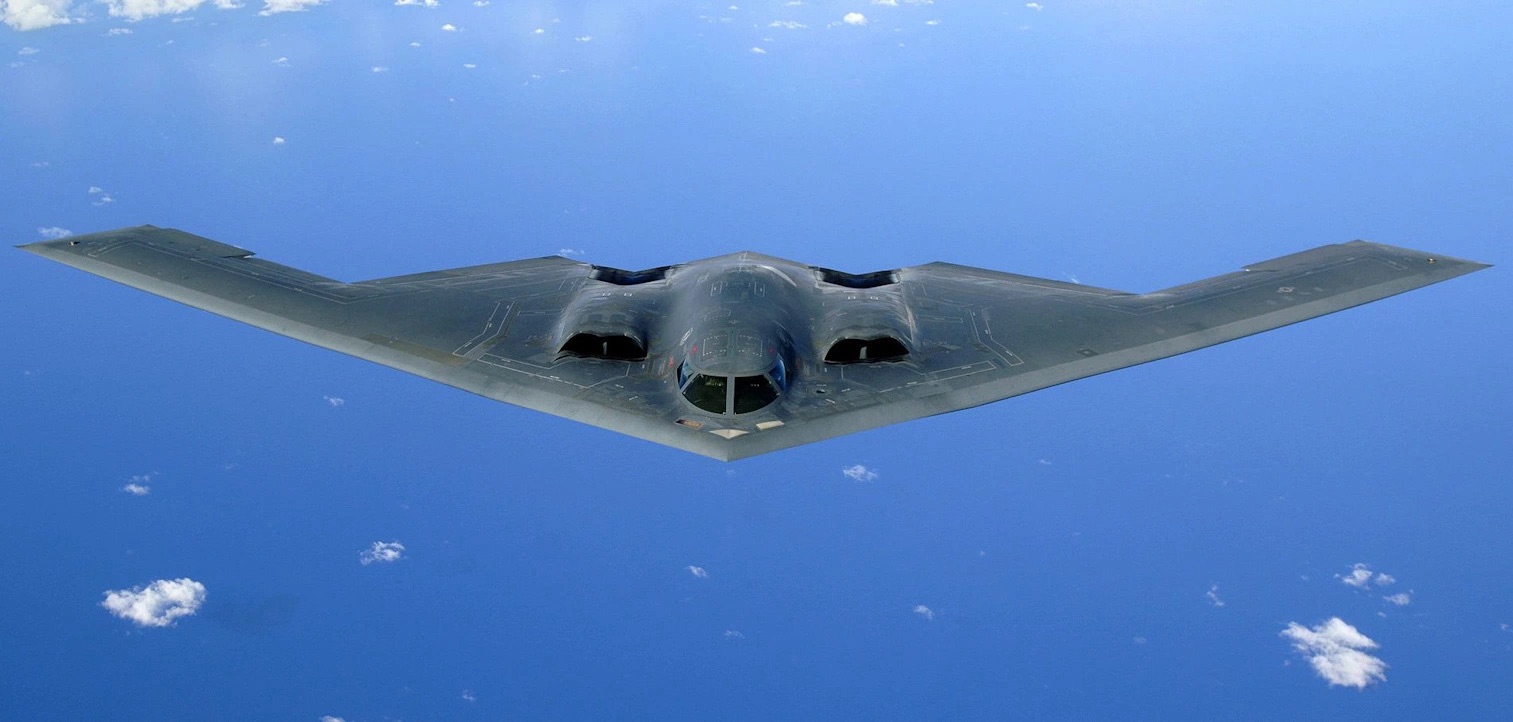 A B-2 Spirit bomber flies over the Pacific Ocean.